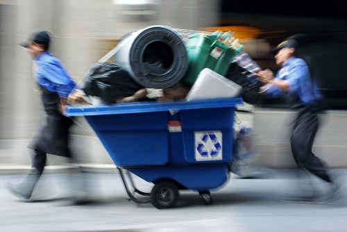 Bulk waste collection truck disposing furniture in Bayswater