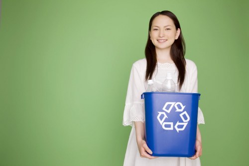 Workers sorting recyclables in a commercial waste area